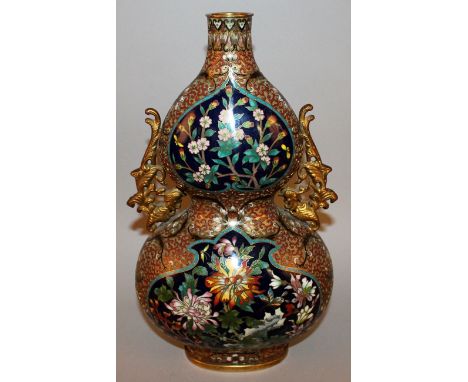 A GOOD QUALITY CHINESE DOUBLE-GOURD CLOISONNE VASE, decorated with floral panels reserved on a raised scroll ground, the side