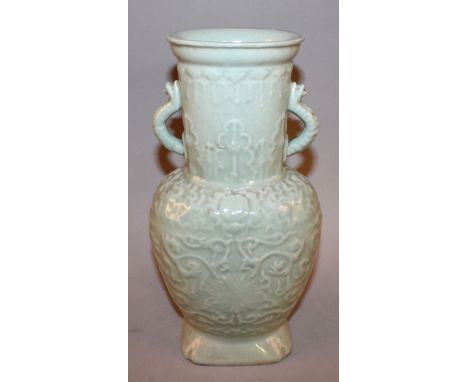 AN EARLY/MID 20TH CENTURY CHINESE MOULDED CELADON PORCELAIN VASE, decorated with scroll-stemmed lotus between formal borders,