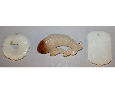 A CHINESE WHITE JADE-LIKE PENDANT, decorated with sages and calligraphy, 2in high; together with two other jade-like pieces, 