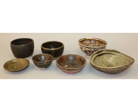 A GROUP OF SEVEN SOUTH-EAST ASIAN CERAMIC BOWLS, variously glazed and shaped, 14th Century and later, the mis-shaped bowl 8.5