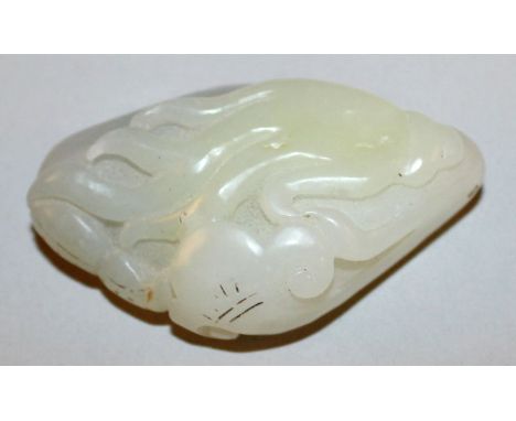 A CHINESE PALE CELADON JADE PEBBLE-FORM CARVING, carved to one surface in relief with finger citron and lingzhi, 2.2in long.