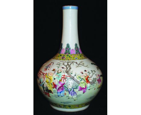 A CHINESE FAMILLE ROSE PORCELAIN BOTTLE VASE, the sides painted with a continuous scene of boys playing in a fenced garden se