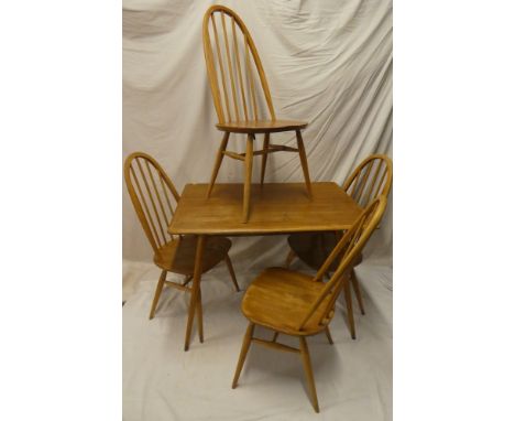 A 1960's Ercol pale elm rectangular dining table, 39" x 27", together with a set of four Ercol light elm spindle back dining 