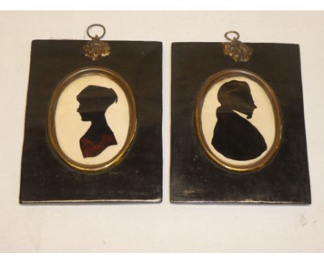 A pair of 19th century silhouette miniatures depicting bust portrait of "Lord Creighton-Stewart" and one other female portrai