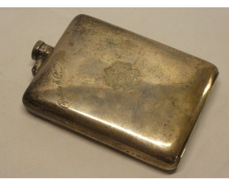 A large silver rectangular hip flask named to a Captain E Carey of The Highland Light Infantry with engraved regimental badge