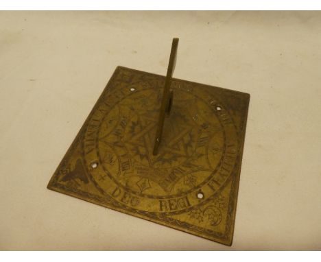 An 18th century brass Masonic sundial by Charles Merry of London dated 1749, engraved with Masonic emblems and "Deoregi Fratr