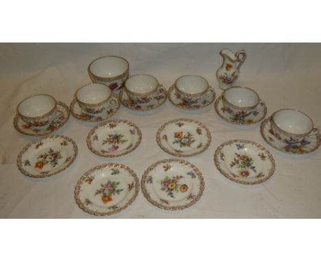 A Dresden porcelain tea set with painted floral decoration comprising six teacups, six saucers, six tea plates, pedestal crea