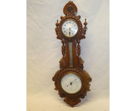 A good quality aneroid barometer with circular ceramic dial below thermometer and 8 day clock in carved walnut nautical-style