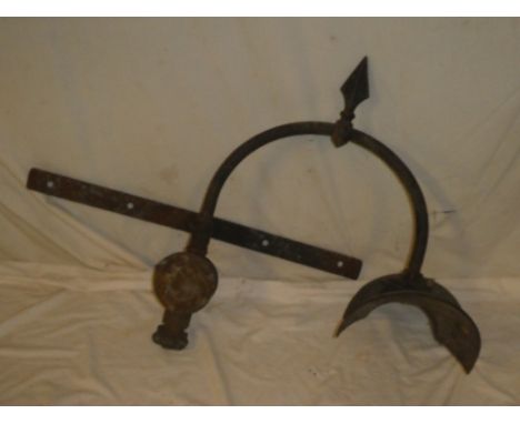 An old painted metal external light fitment with arched stem