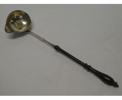 A George III silver toddy ladle inset with a 1787 shilling with turned handle