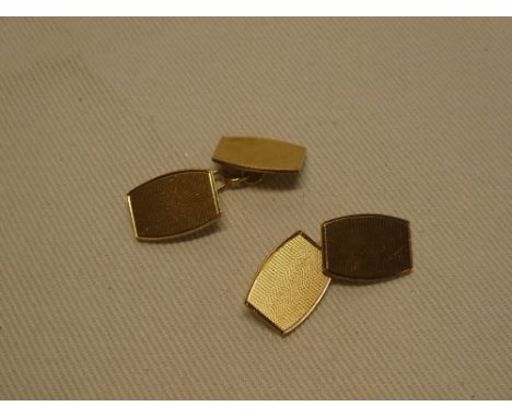 A pair of 9ct gold cufflinks with engine turned decoration