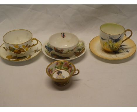 Three various cabinet cups and saucers with painted decoration and one other individual cup 