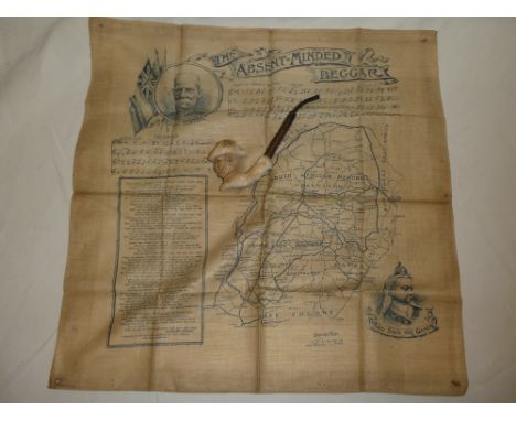 A Boer War silk map of South Africa with "The Absent-Minded Beggar" decoration and a Boer War period china clay pipe in the f