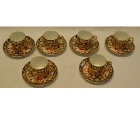 A Royal Crown Derby china coffee set comprising 6 coffee cups and 6 saucers with blue, red and gilt decoration