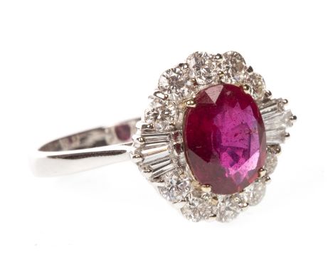 RUBY AND DIAMOND RING, the oval red gem measuring 8x7mm, with indication of treatment, flanked by three tapered baguette cut 