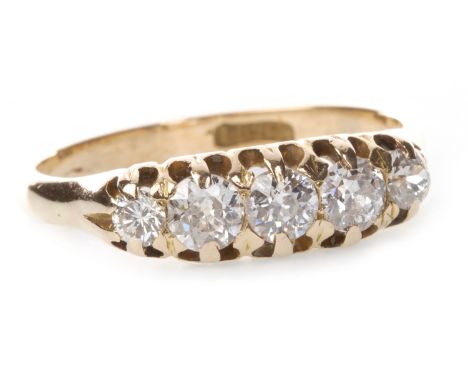 EARLY TWENTIETH CENTURY DIAMOND FIVE STONE RING, set with graduated old round brilliant cut and old cushion cut diamonds tota