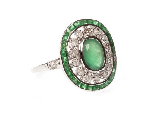 EMERALD AND DIAMOND RING, the oval emerald surrounded by illusion set round brilliant cut diamonds totalling approximately 0.
