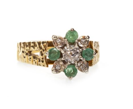 LATE 20TH CENTURY GREEN GEM AND DIAMOND CLUSTER RING, the floral motif bezel with a central round brilliant cut diamond of ap