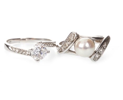 GEM SET RING, the round white gem in a twist setting with smaller round white gems to the shoulders, marks indistinct, size N