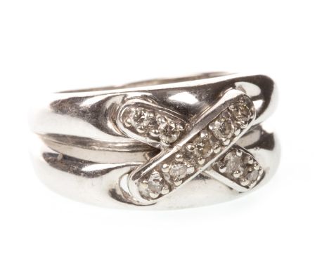 DIAMOND CROSSOVER RING, 9mm wide, with overlaid diamond crossover section, the round brilliant cut diamonds totalling approxi