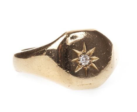 GENTLEMAN'S DIAMOND SET SIGNET RING, with a central star set round brilliant cut diamond of approximately 0.04 carats, marks 