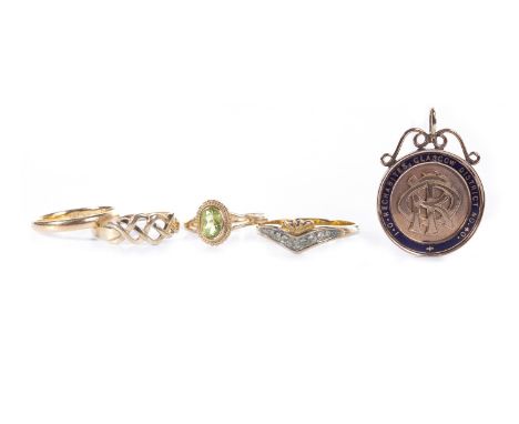 GREEN GEM SET RING, the oval faceted green gem 6mm long and on bifurcated shoulders, in nine carat gold, size N, 1.6g; along 