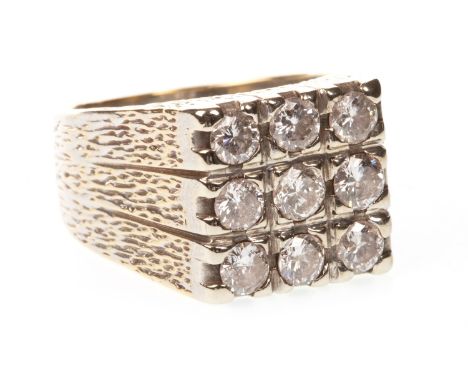 GENTLEMAN'S DIAMOND RING, the square bezel set with nine round brilliant cut diamonds totalling approximately 1.10 carats, on