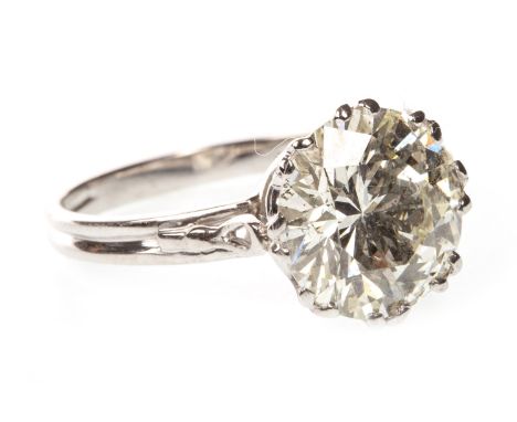 DIAMOND SOLITAIRE RING, the round brilliant cut diamond of approximately 5.01 carats, unmarked, size R 1/2, 4.5g