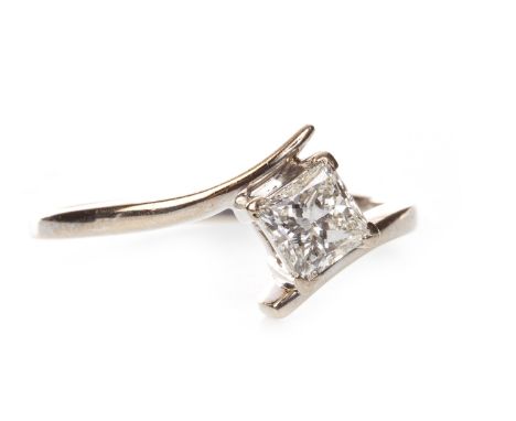 DIAMOND SOLITAIRE RING, the princess cut diamond of approximately 0.60 carats, in eighteen carat gold, size R, 3.2g