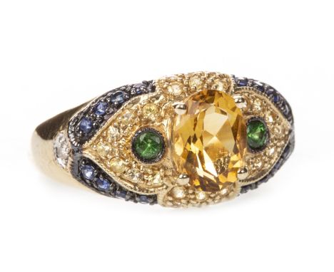 GEM SET DRESS RING, the central oval yellow gem 8mm long, flanked by two round green gems, bordered by round yellow and blue 