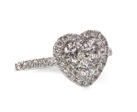 HEART SHAPED DIAMOND RING, the bezel set with three round brilliant cut diamonds within a halo of smaller diamonds, on diamon