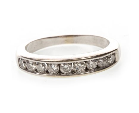 DIAMOND HALF ETERNITY RING, the channel set round brilliant cut diamonds totalling approximately 0.50 carats overall, marked 