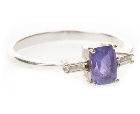 PURPLE GEM SET AND DIAMOND RING, the rectangular purple gem 6mm long, flanked by two baguette cut diamonds of approximately 0