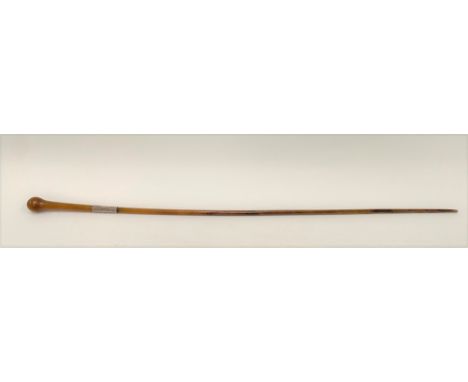 A Victorian rhino horn slender swagger stick with silver collar and engraved monogram, length 76cm, weight 83g approx