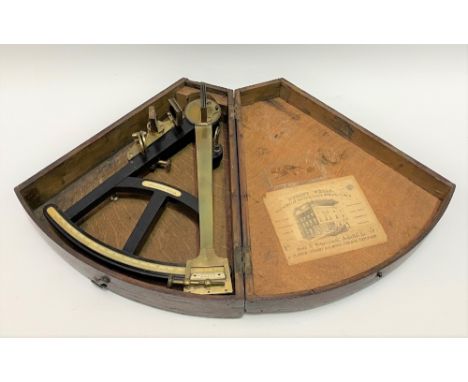 A 19th century oak cased sextant in brass and ebony and with ivory scales and tablet signed WELLINGTON. LONDON, the case with