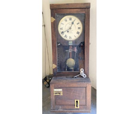 A clocking-in clock, the 9in painted dial signed 'THE GLEDHILL-BROOK TIME RECORDERS LTD PATENT HUDDERSFIELD, HALIFAX, LONDON 