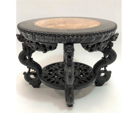 Small Chinese circular hardwood low two tier table, the circular top with marble inset and with beaded edge over four dragon 