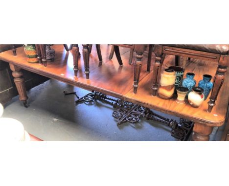 Victorian mahogany rectangular extending dining table, the moulded top with two extra leaves, raised on four turned and flute