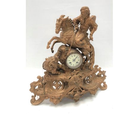 A French gilt spelter figural mantel clock with 3in dial and two-train movement, the case modelled as a Turk on a rearing hor