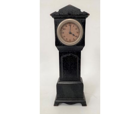 A novelty ebony timepiece in the form of a long case clock and with 1.75in dial, height 26.5cm