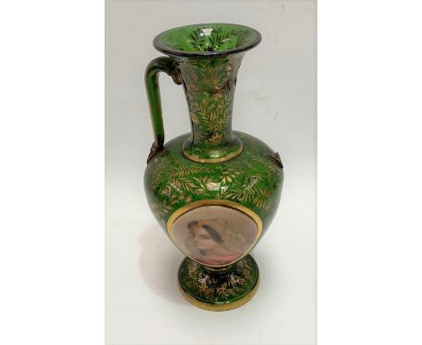 A 19th century Bohemian green glass pedestal vase, the front with oval white opaque portrait panel of a young woman within a 