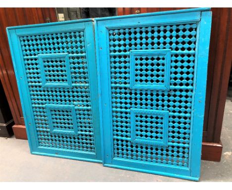 Pair of Indian blue painted bed ends with bobbin trellis panel, width 104cm.