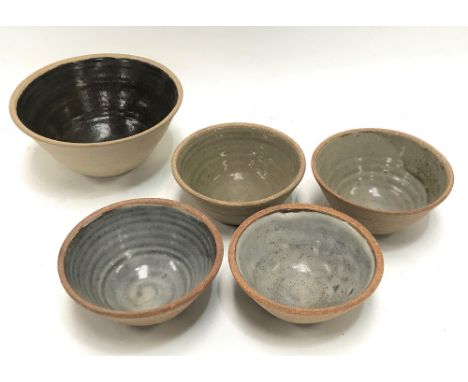A set of three St Ives Leach studio pottery standardware bowls, together with two other bowls (5). 