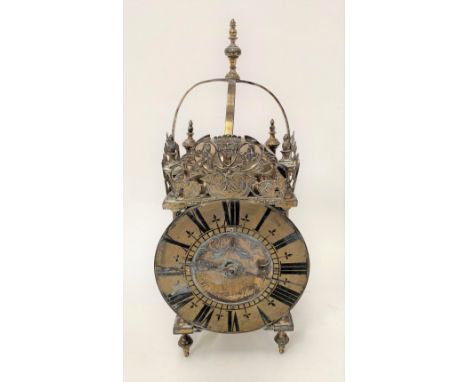 A brass cased lantern clock with two-train movement striking on a gong, the 6in dial signed Amomette a Hoyon, height 33cm