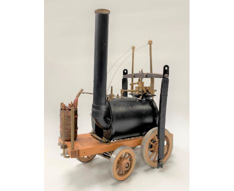 A model steam engine in the form of Richard Trevithick's locomotive, height 28cm.