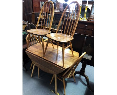 An Ercol pale elm drop-leaf circular table with set of six hoop and stick back chairs, diameter of table 113cm