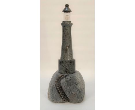 A grey Cornish serpentine lighthouse table lamp, height 48cm.