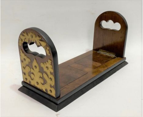 A Victorian walnut veneered extending book trough, the hinged handles with foliate pierced brass applied strapwork, width 30c