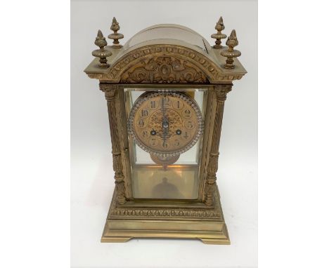 A good French brass four glass, two train clock by J. Marti &amp; Cie, striking on a gong, the 3.5' brass dial with black pai