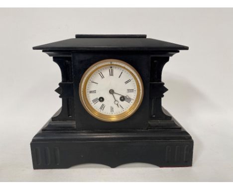 A black slate two-train mantel clock with 3.5in dial, the French movement striking on a bell, within architectural case, heig